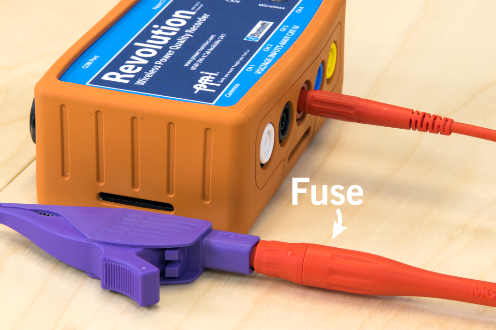 Figure 3. Fused test lead connect to Revolution voltage input with fused end connected to dolphin clip (below)