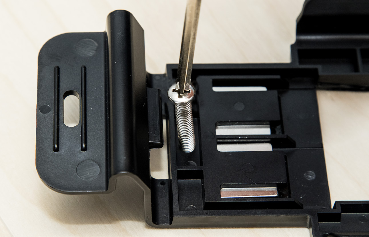 Figure 7. Mounting bracket being screwed into place (above)