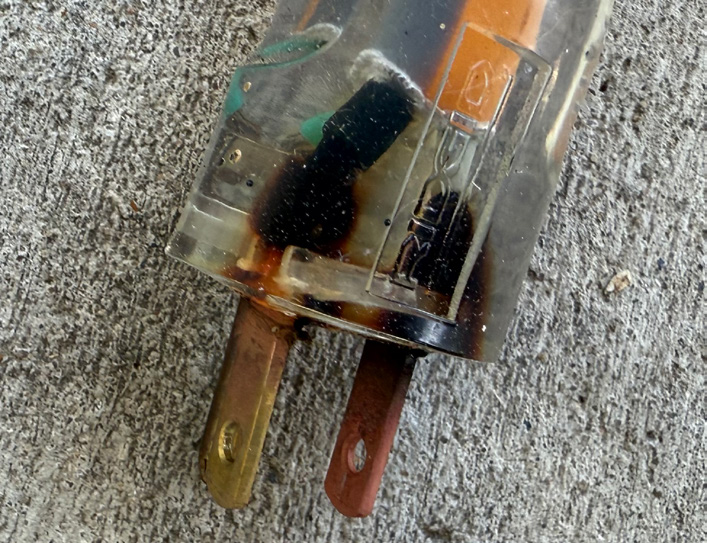 Figure 1. The plug from the extension cord in question. Note: The charring as seen through the transparent plug.